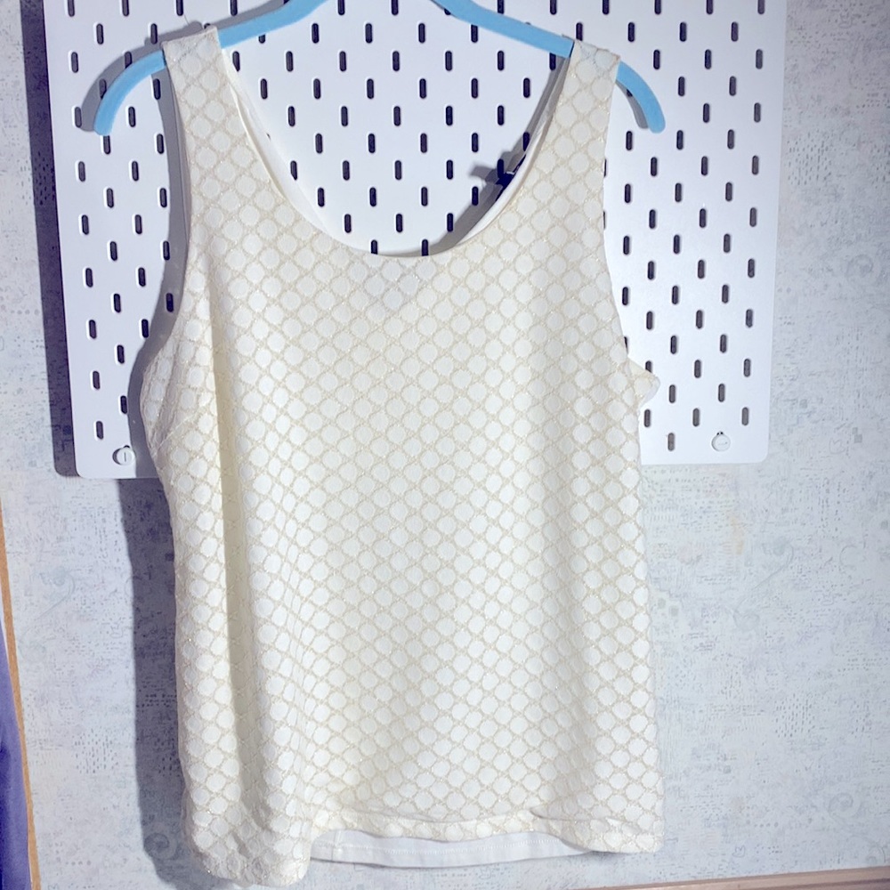 Cream colored tank with gold accents.